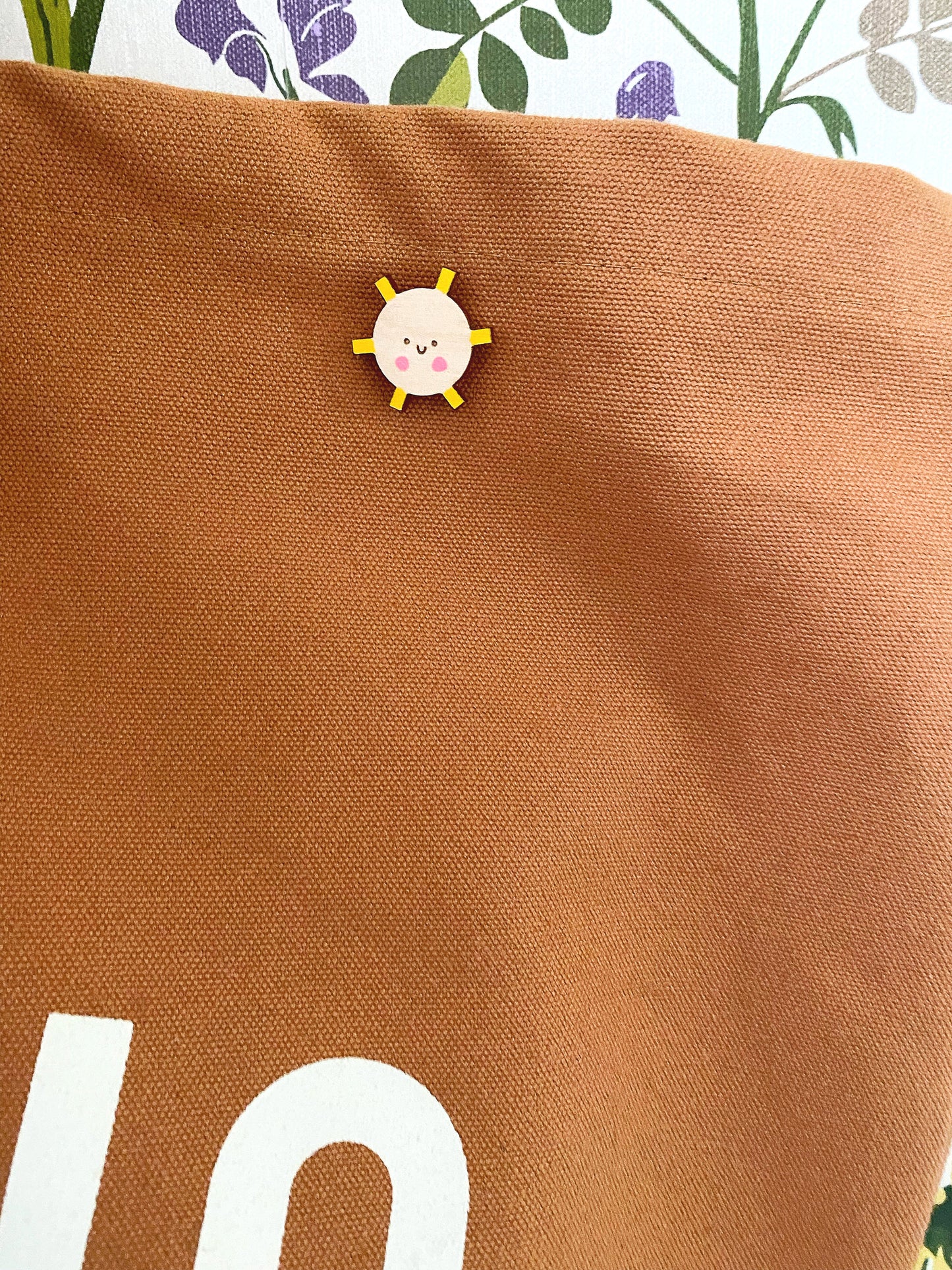 Smiley sunshine pin badge